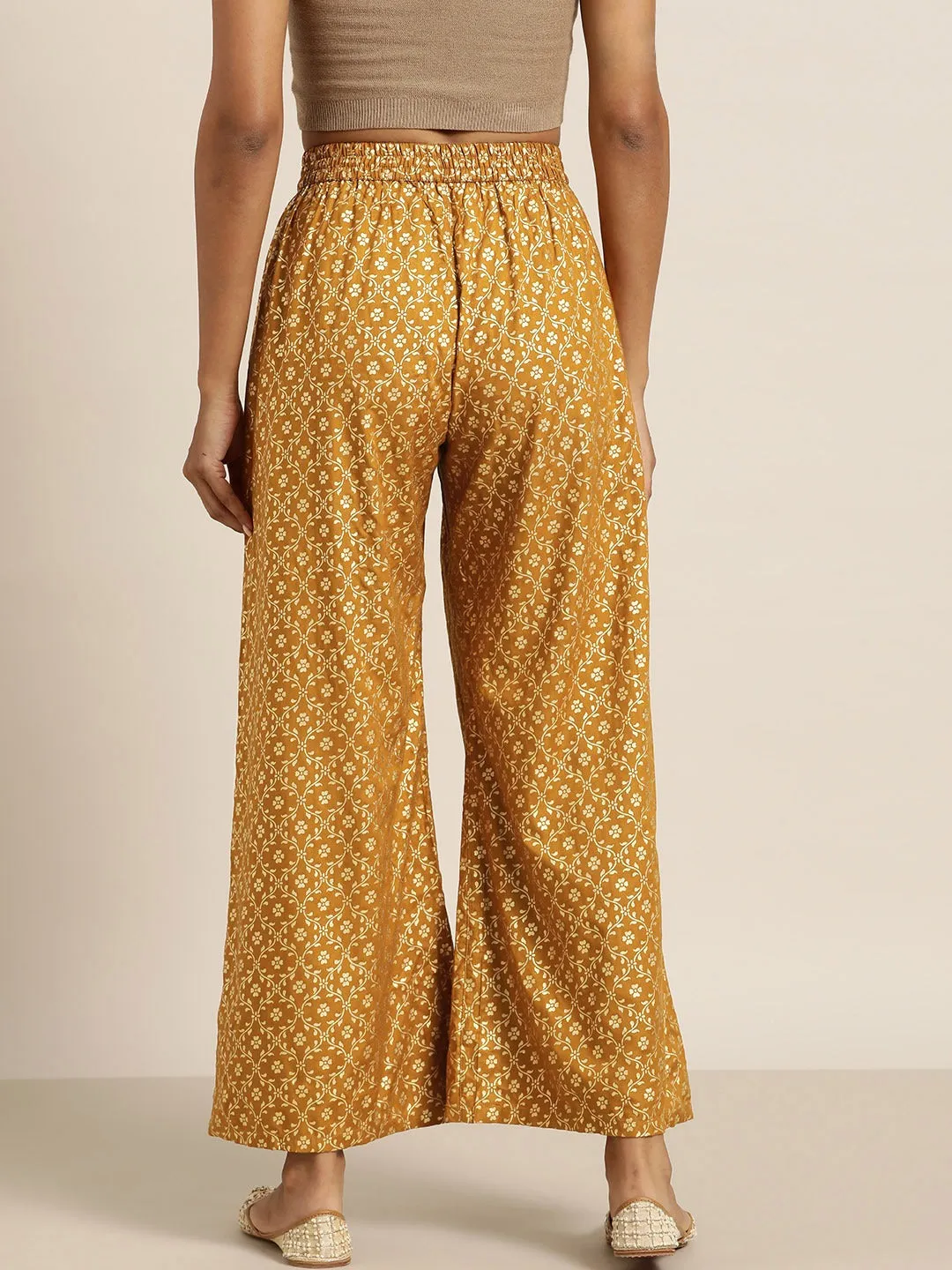 Women Mustard Foil Print Flared Liva Pants